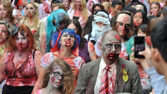 People dressed as zombies participate in the annual Sydney Zombie Walk, in Sydney, Saturday, Nov. 2, 2013. Event organisers were raising funds to support The Australian Brain Foundation, a charity dedicated to funding research into finding cures for a range of brain disorders. (AAP Image/Joel Carrett) NO ARCHIVING