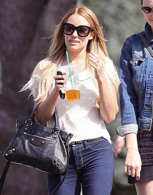 Reality star Lauren Conrad shares a laugh with a friend over a tea as a lost looking dog approaches her in Santa Monica, CA. Pictured: Lauren Conrad Ref: SPL396753 240512 Picture by: MOVI Inc./ DK/Splash News Splash News and Pictures Los Angeles:310-821-2666 New York: 212-619-2666 London: 870-934-2666 photodesk@splashnews.com 